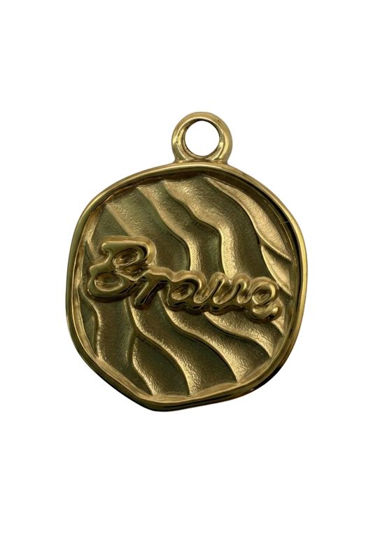 Gold textured coin with raised “amour” script and wavy pattern