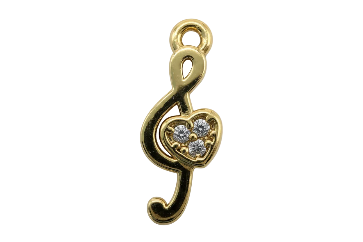 Gold pin-shaped piece with a heart center and three clear crystals
