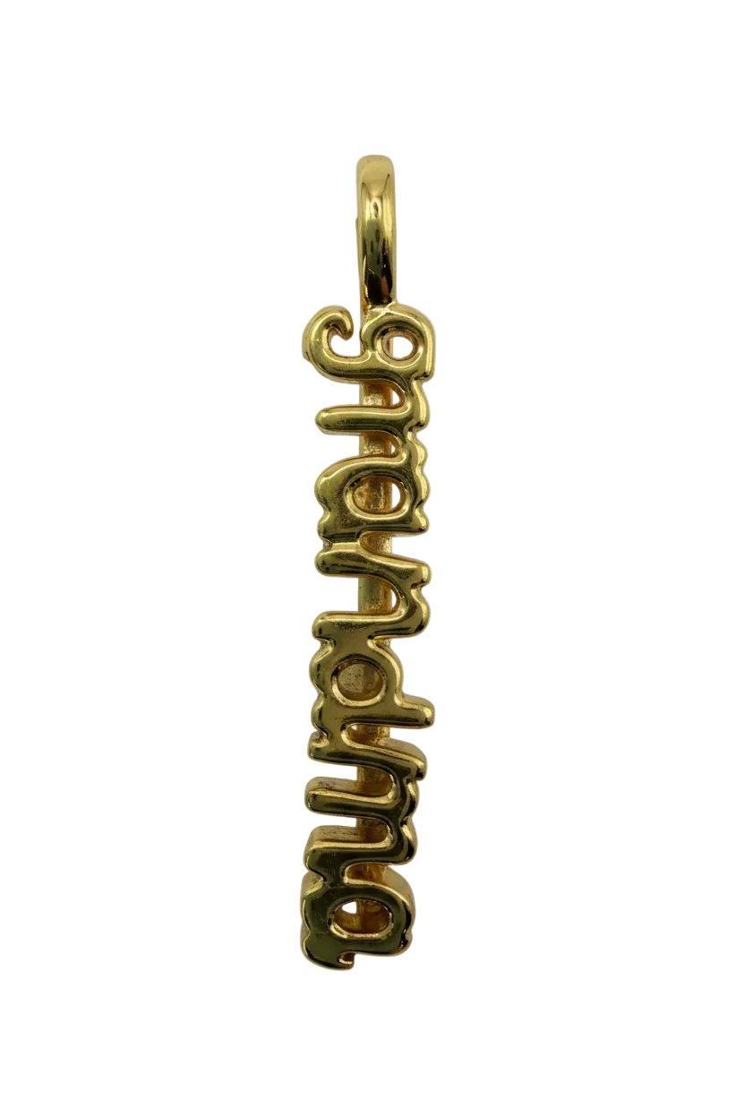 Polished gold script "aupair" word charm with smooth cursive lettering