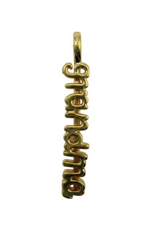Polished gold script "aupair" word charm with smooth cursive lettering