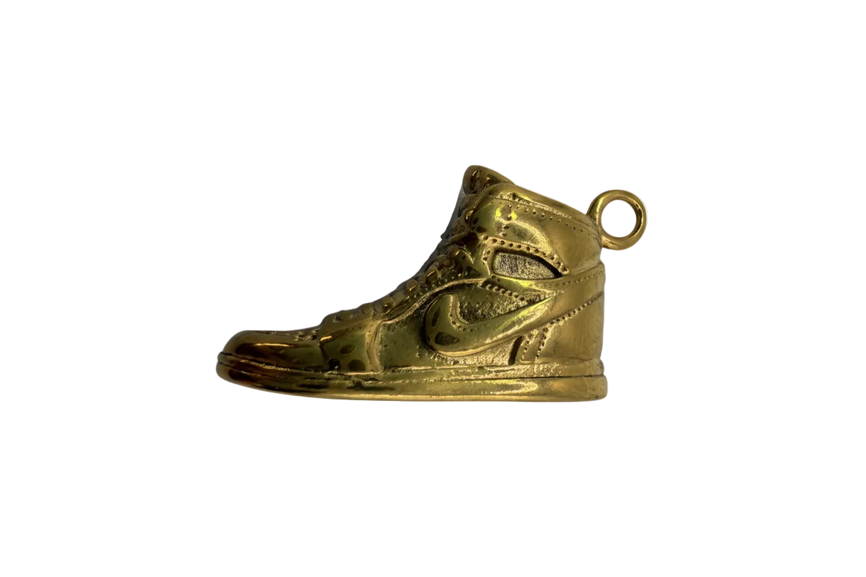 Gold high-top sneaker charm with embossed details