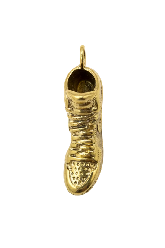Glossy gold sneaker shoe charm with textured sole and lace details