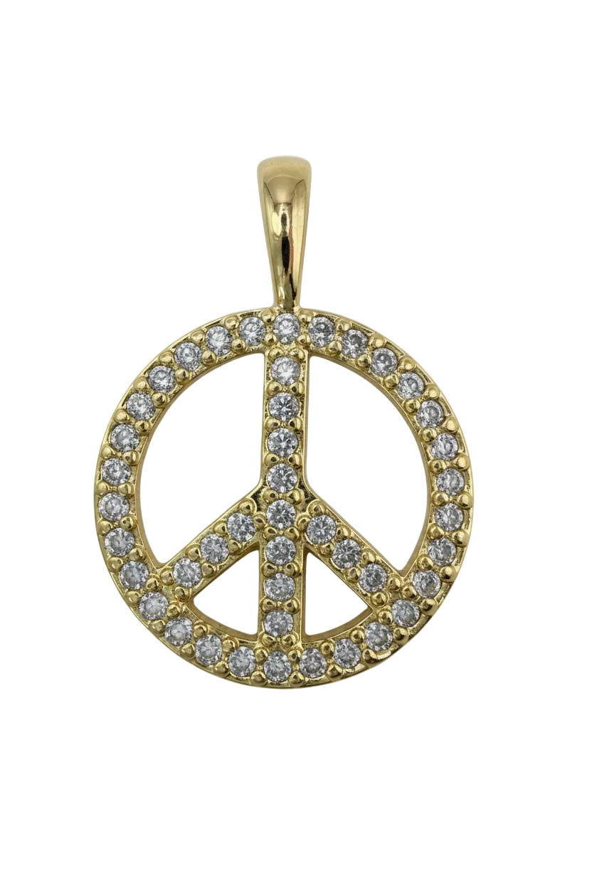 Gold peace symbol medallion with pavé clear crystals on a black background