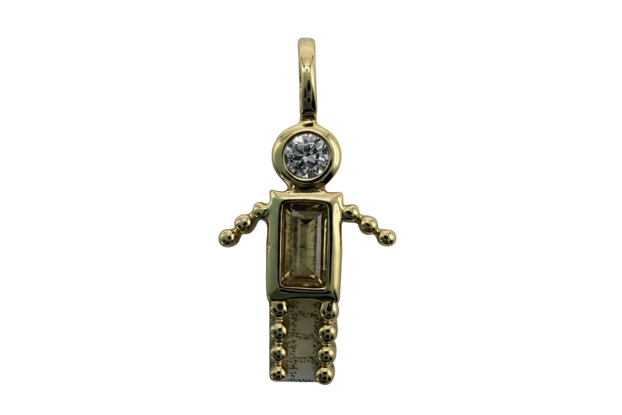Gold gecko charm with clear round gem and smoky rectangular gem on black background