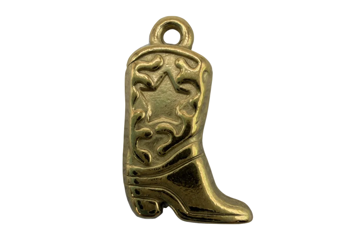 Gold engraved pistol charm with raised scrollwork and star detail