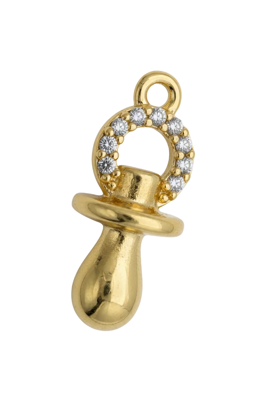 Gold pacifier charm with pavé circle of clear crystals on a black background