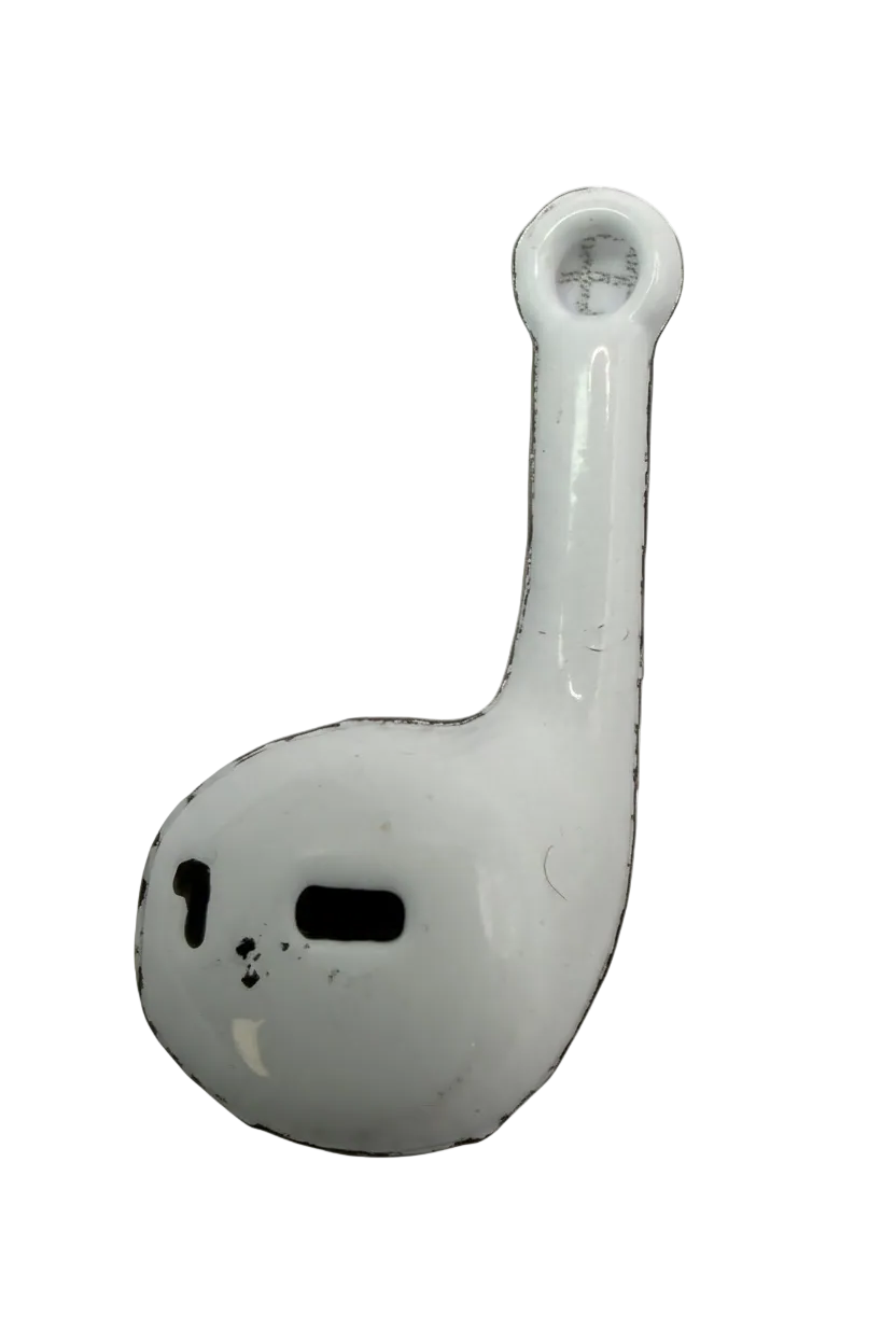 Glossy white wireless earbud charm with black details on a black background