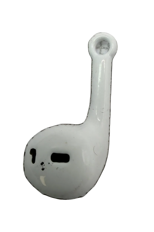 Glossy white wireless earbud charm with black details on a black background