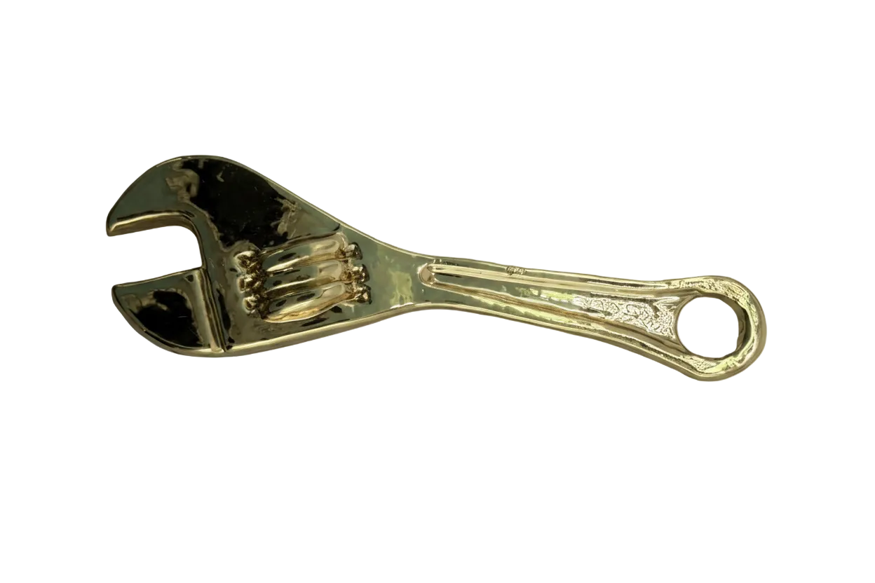 High-shine gold wrench tool pendant with sculpted grip details