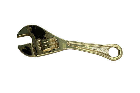 High-shine gold wrench tool pendant with sculpted grip details