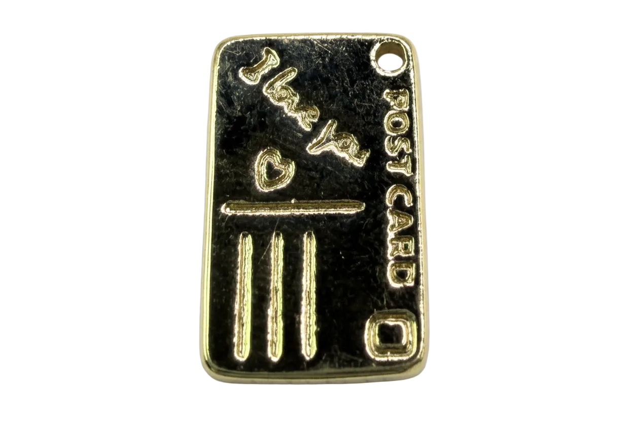 Polished gold-tone rectangular bullion bar tag with raised lettering and bar details