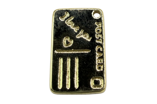 Polished gold-tone rectangular bullion bar tag with raised lettering and bar details