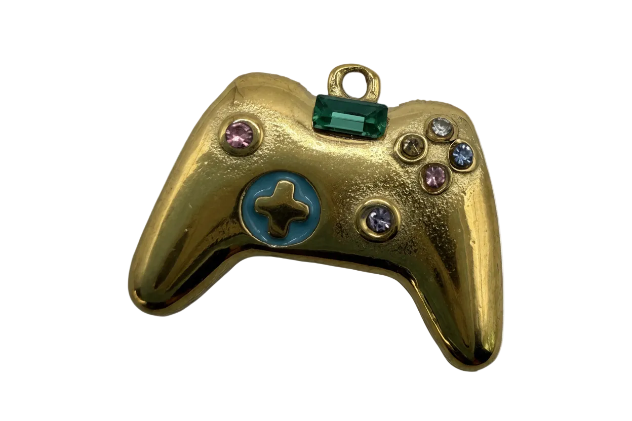 Gold game controller charm with green rectangular gem, blue enamel detail, and multicolor crystals