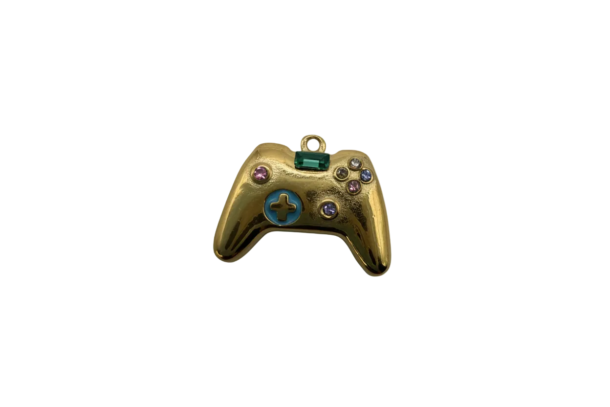 Gold game controller with green gem, blue enamel, and multicolor crystals