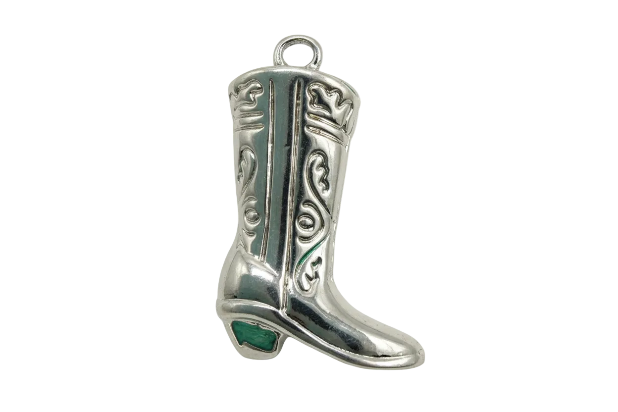 Ornate silver cowboy boot charm with engraved scrollwork and darkened details