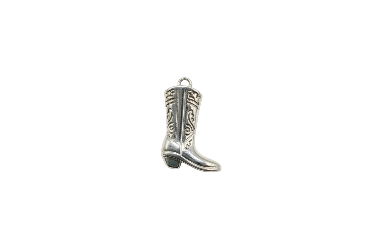 Silver cowboy boot with engraved scrollwork and darkened details