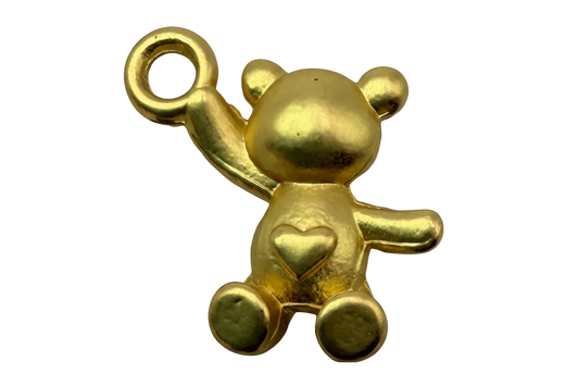 Polished gold teddy bear figure with raised arm and small heart detail on belly