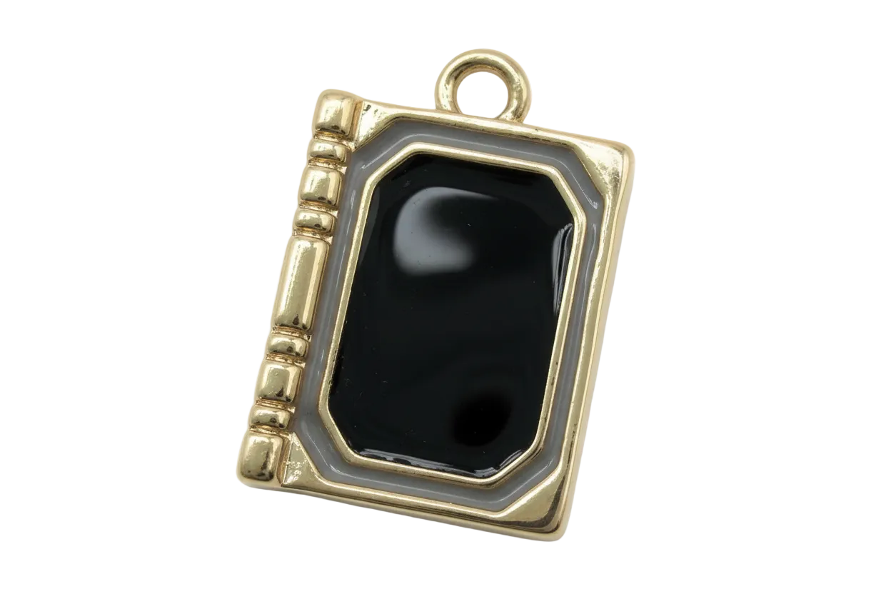 Gold book-shaped locket charm with glossy black center and gray border