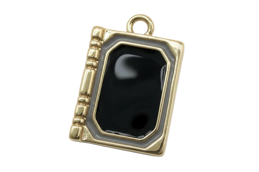 Gold book-shaped locket charm with glossy black center and gray border
