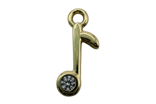 Polished gold music note with a clear faceted gem accent
