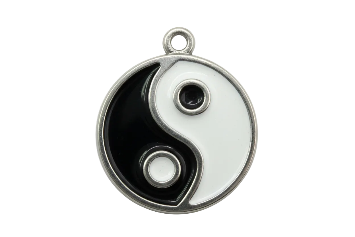 Black and white yin yang disc with glossy enamel and polished silver frame