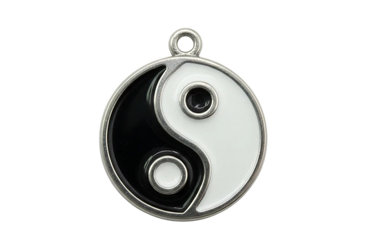 Black and white yin yang disc with glossy enamel and polished silver frame