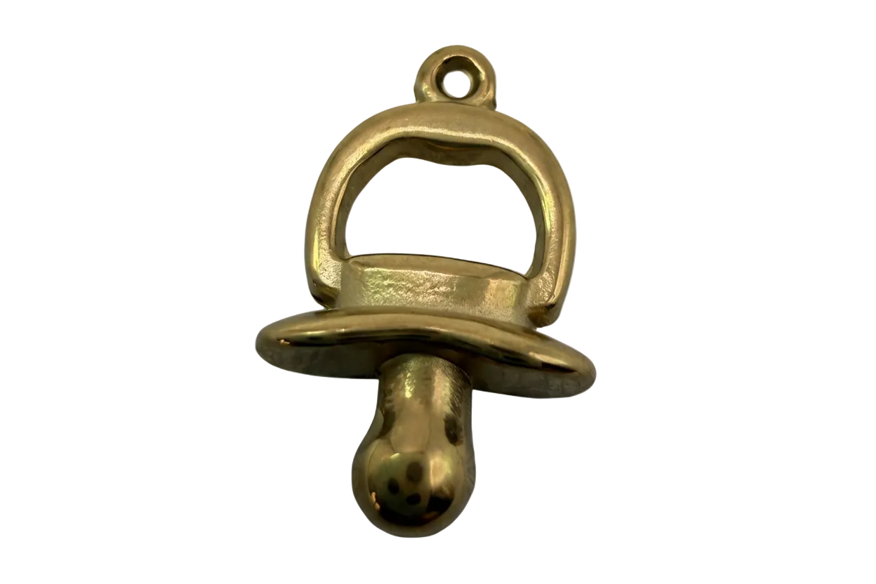 Polished gold pacifier charm with rounded, high-shine finish