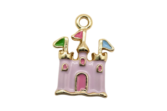 Gold-toned pastel pink enamel castle with multicolor turret roofs and pink door
