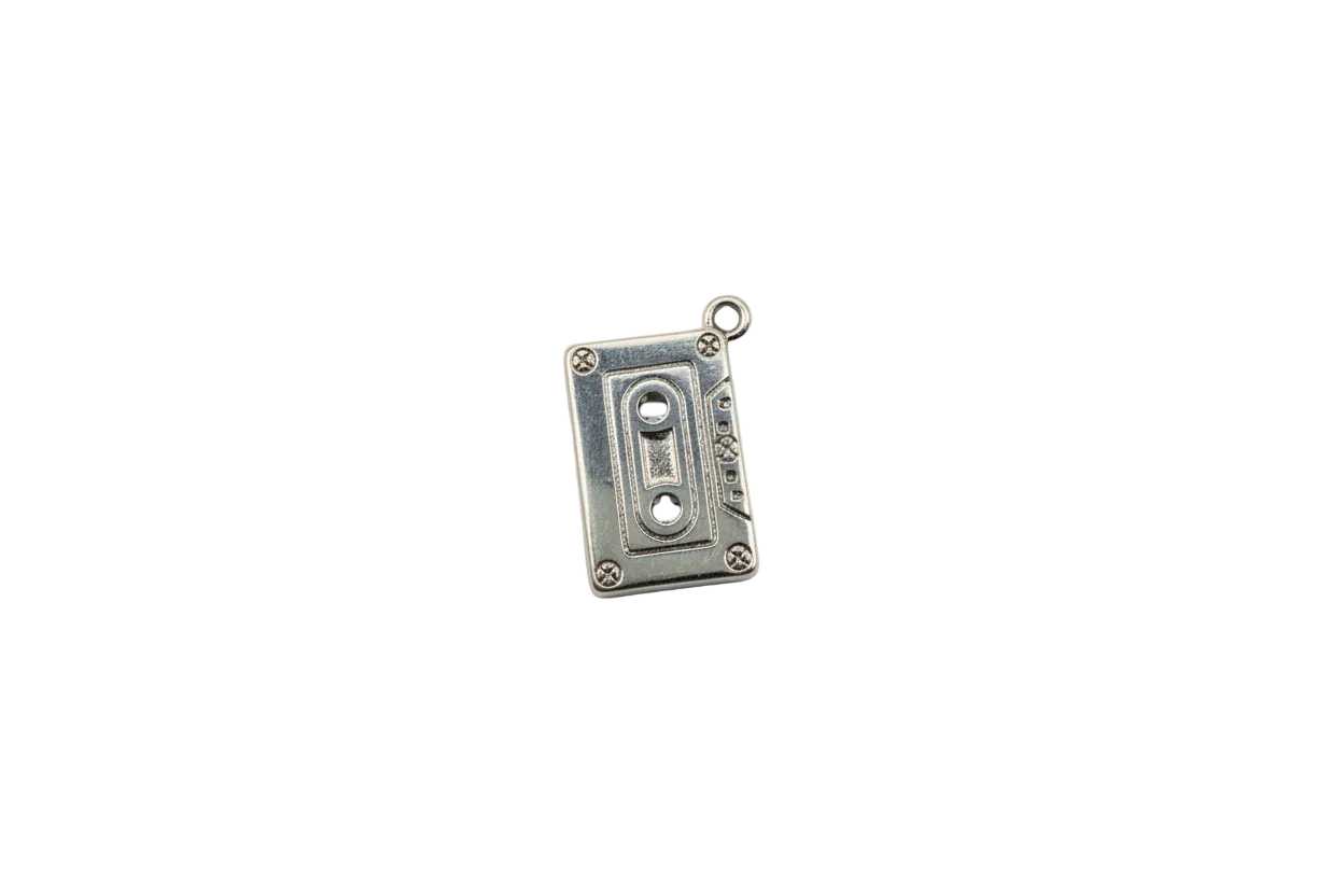 Silver cassette tape charm with engraved reel details