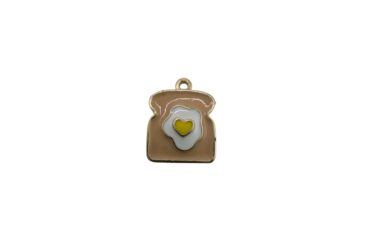 Toast with fried egg and heart yolk in gold and enamel