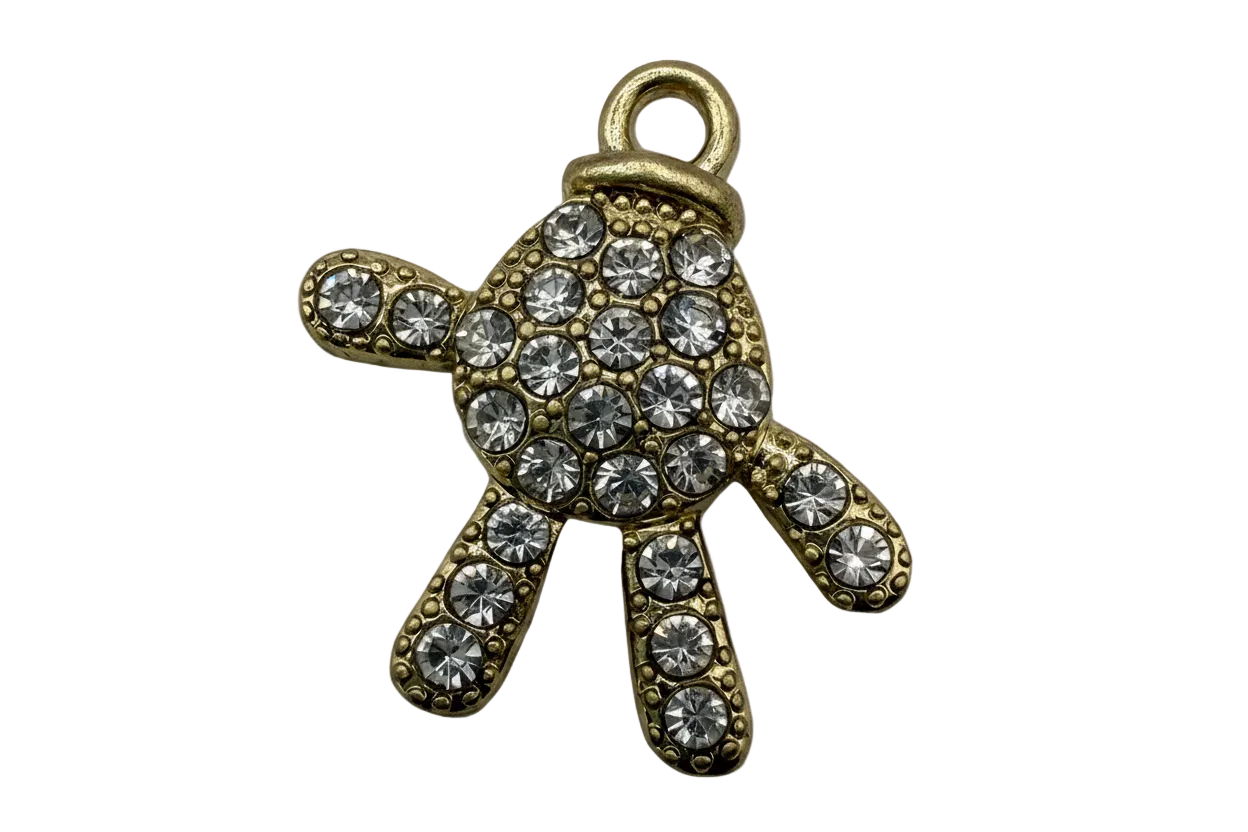 Gold turtle charm with pavé clear crystals and textured detailing