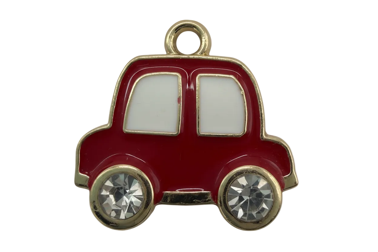 Glossy red enamel car silhouette with gold trim, white windows, and clear faceted crystal wheels