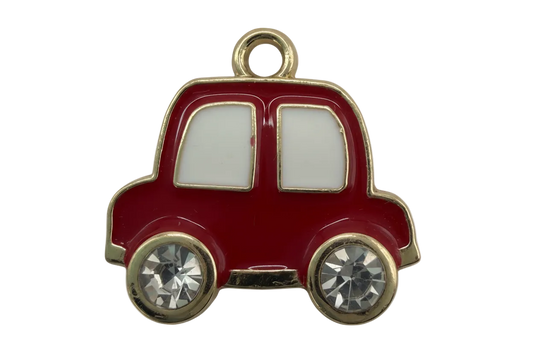Glossy red enamel car silhouette with gold trim, white windows, and clear faceted crystal wheels