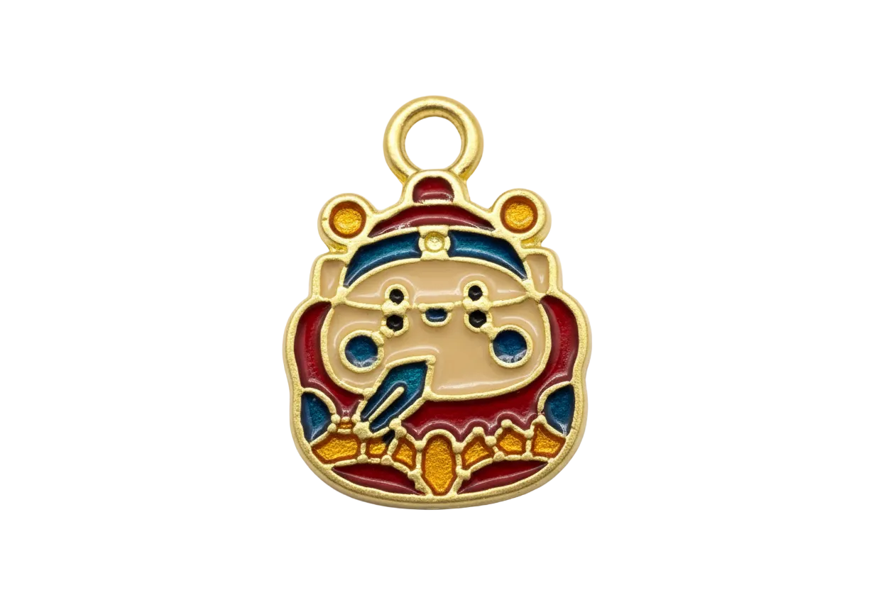 Gold bear face charm with cream, red, navy, and amber enamel details