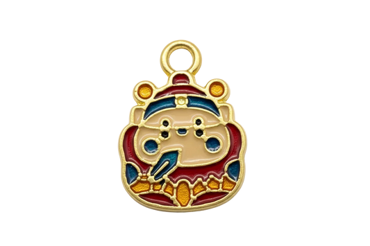 Gold bear face charm with cream, red, navy, and amber enamel details