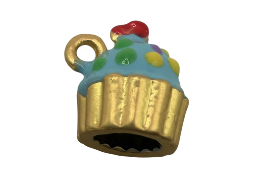 Gold cupcake charm with light blue icing and multicolor sprinkles, topped with a red accent