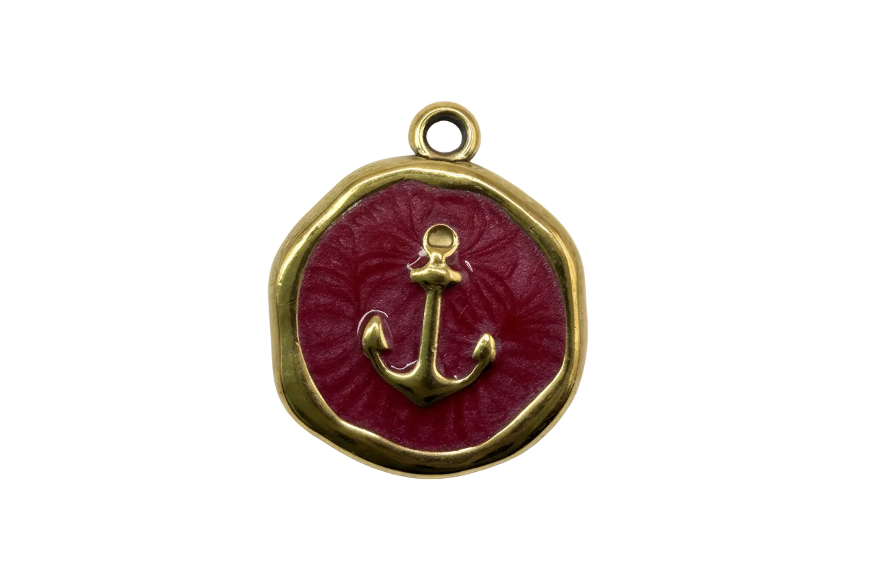 Gold anchor medallion with glossy red enamel center and rounded square frame