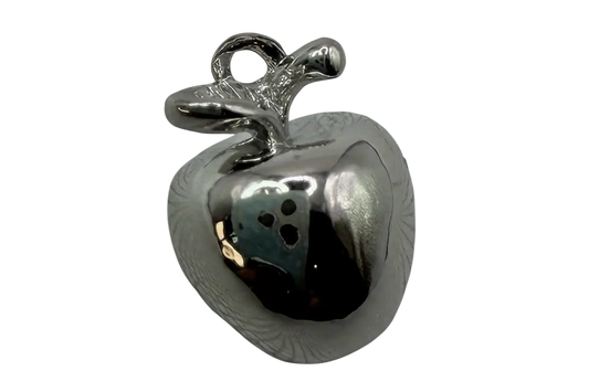 Mirror-polished silver apple charm with sculpted leaf and smooth rounded body