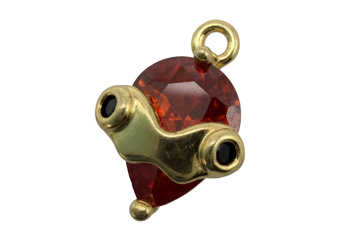 Faceted red heart gem with polished gold goggles and black lens details