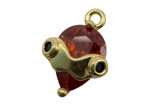Faceted red heart gem with polished gold goggles and black lens details
