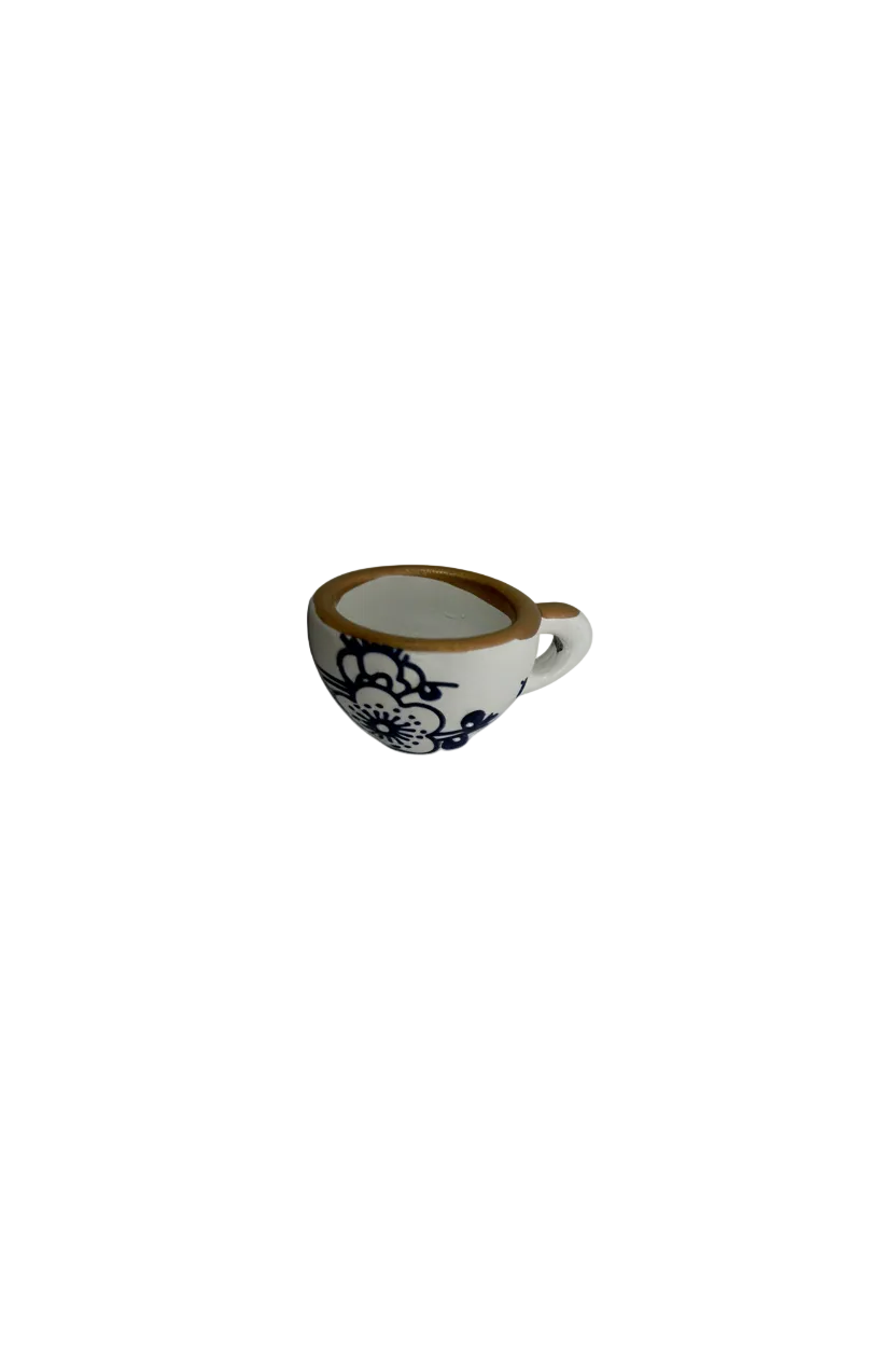 White oval with black lace floral design and gold edge