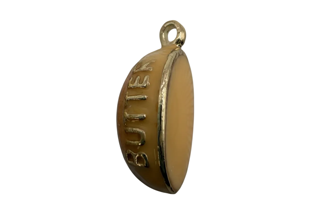 Butterscotch candy charm with raised gold “BUTTER” lettering and glossy caramel enamel finish
