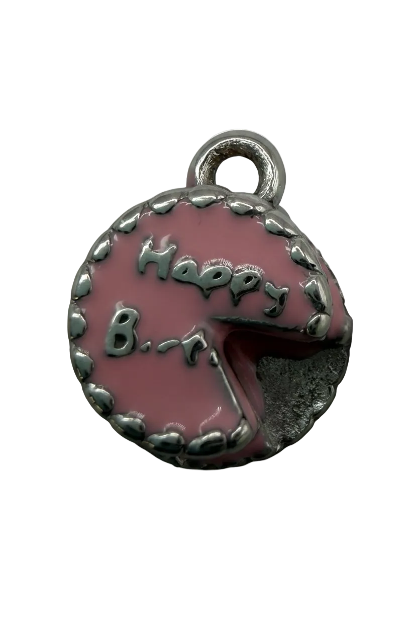 Round pink frosted cookie medallion with raised silver-tone lettering and bite detail, silver finish