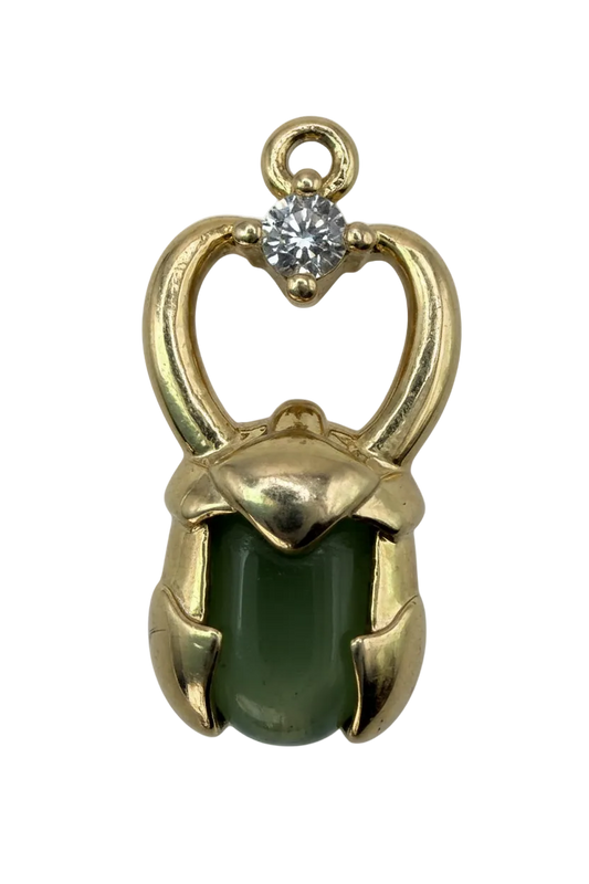 Gold charm featuring a green cat-eye cushion stone with a small clear crystal accent