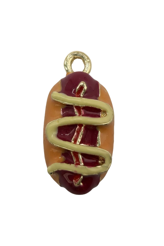 Gold hot dog charm with tan bun, red ketchup and yellow mustard drizzle, glossy enamel finish