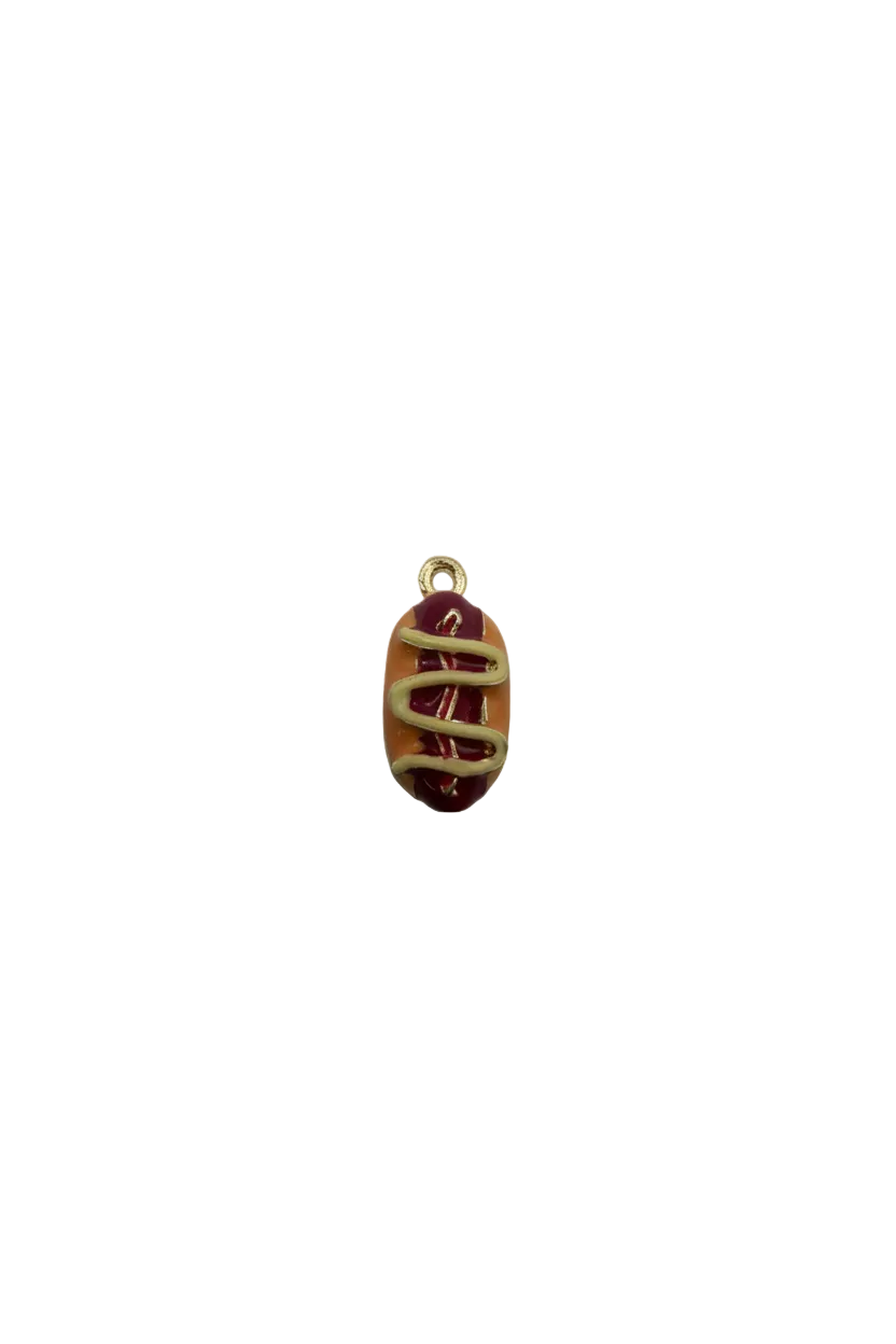Gold hot dog with tan bun and red/yellow drizzle, glossy enamel