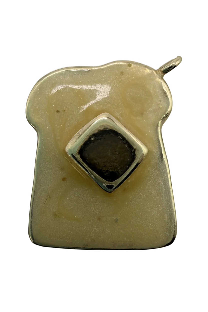 Ivory enamel dog bone charm with gold outline and black square center