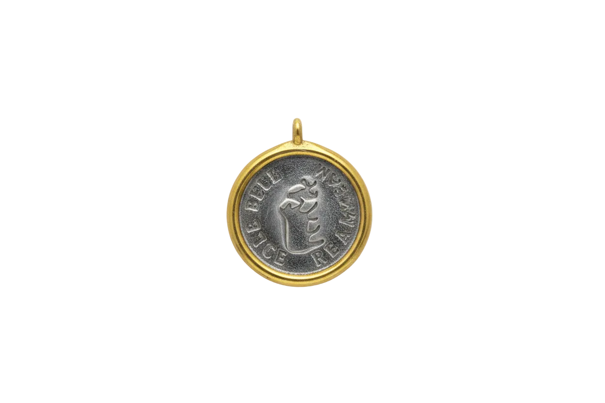 Two-tone coin medallion with raised cow motif, gold rim and silver center
