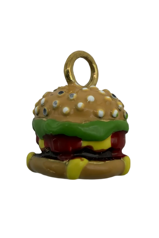 Glossy sesame bun cheeseburger charm in gold with red, green, yellow, and white enamel details