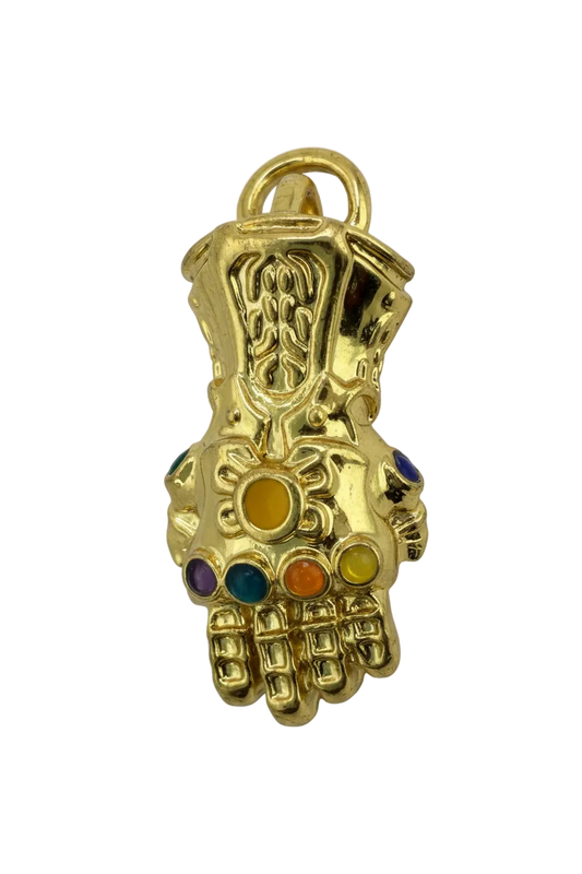 Gold gauntlet hand charm with multicolor gemstone accents on black background